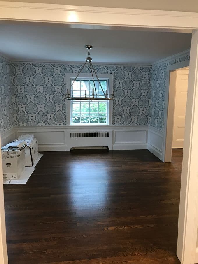 Dining room with polished hardwood floors after a house cleaning