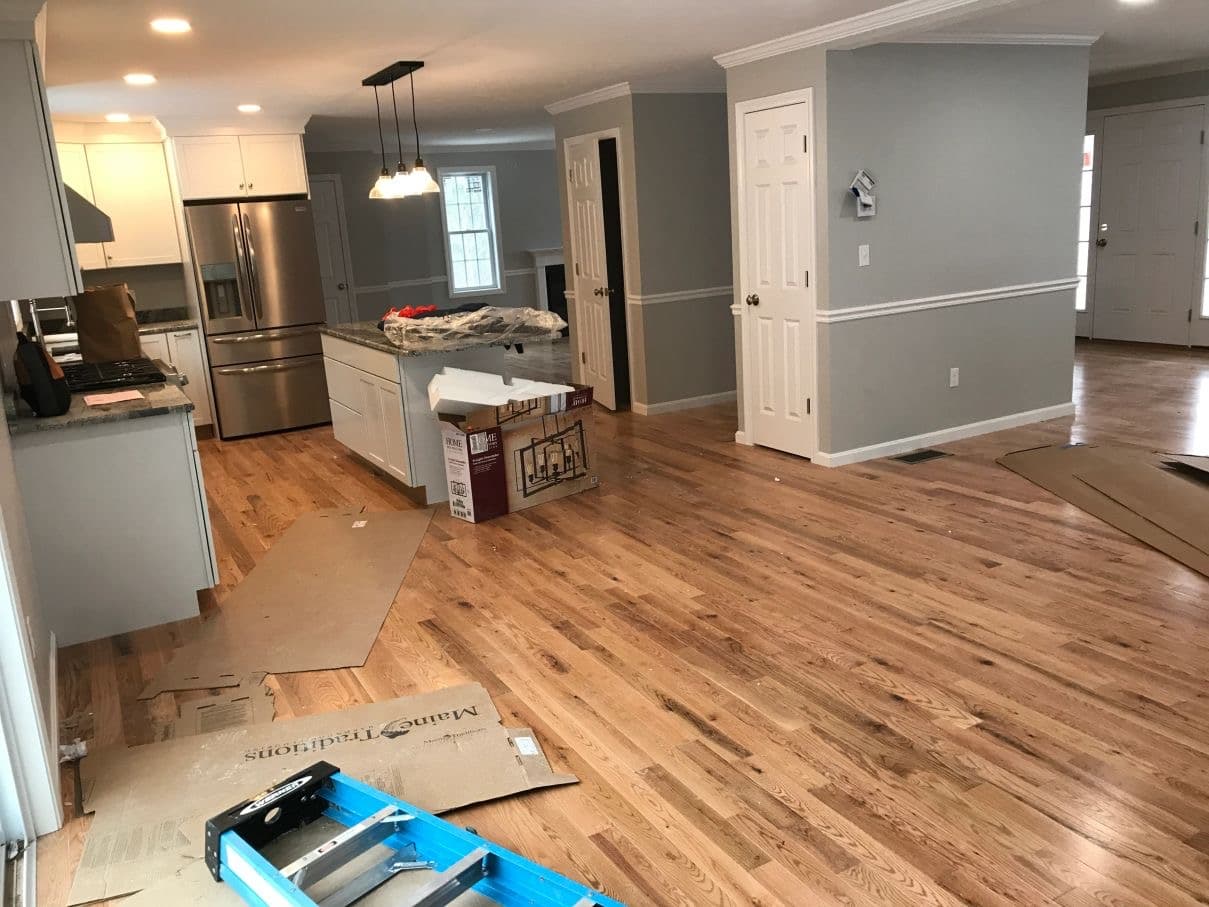 Open-plan kitchen and living area before final construction cleaning