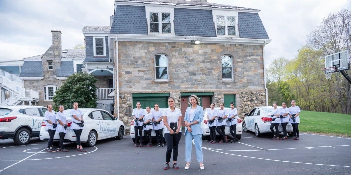 Viviane and the Vcleaning Services team with their fleet of branded cars in Central Massachusetts
