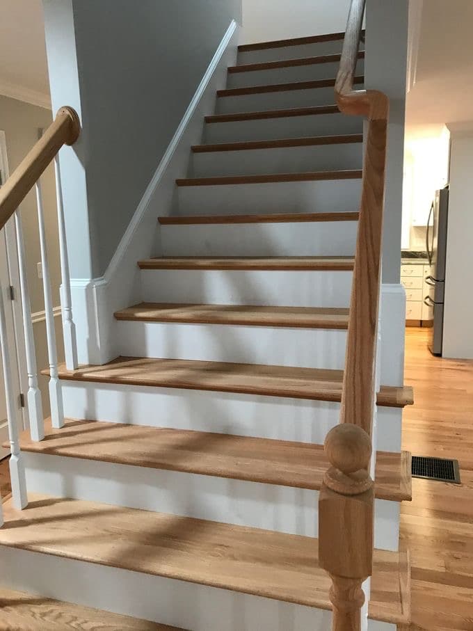 Staircase after cleaning — every riser edge and baluster done by hand